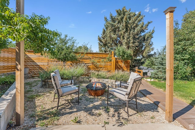 1044 S Terrace Dr E, Bountiful, UT 84010 - view of patio featuring an outdoor fire pit and a wooden deck