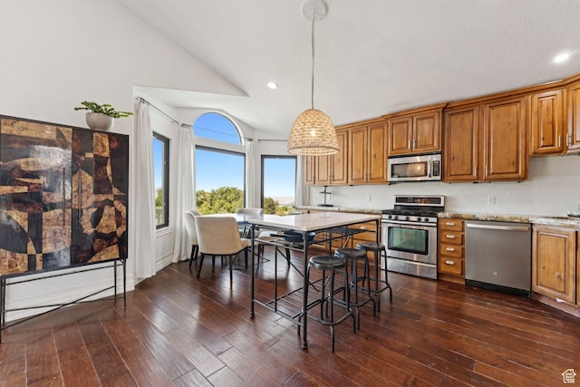 1044 S Terrace Dr E, Bountiful, UT 84010 - kitchen featuring stainless steel appliances, brown cabinets, vaulted ceiling, dark wood-type flooring, and recessed lighting