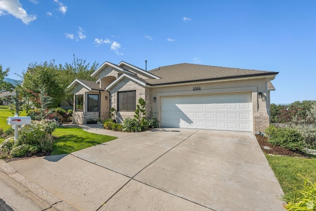 1044 S Terrace Dr E, Bountiful, UT 84010 - single story home featuring concrete driveway, an attached garage, stone siding, and a front lawn
