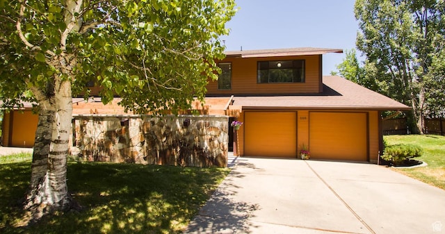 558 E 2025 N, North Ogden, UT 84414 - view of front of property featuring concrete driveway, a garage, and a shingled roof