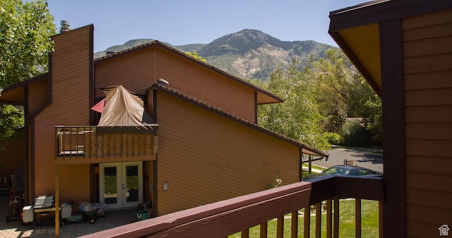 558 E 2025 N, North Ogden, UT 84414 - view of home's exterior featuring french doors, a chimney, and a mountain view