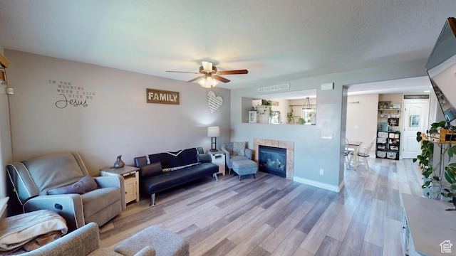 1605 W 1400 S, Vernal, UT 84078 - living area with a ceiling fan, a fireplace, and light wood finished floors