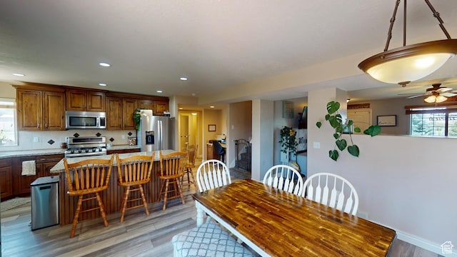 1605 W 1400 S, Vernal, UT 84078 - dining room with light wood-type flooring, a ceiling fan, and recessed lighting