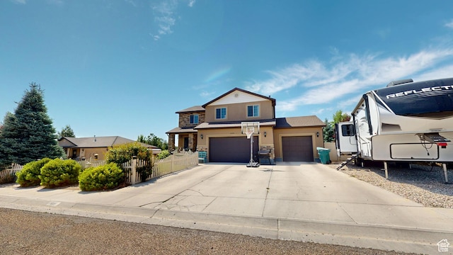 1605 W 1400 S, Vernal, UT 84078 - traditional-style house with stucco siding, concrete driveway, stone siding, and an attached garage