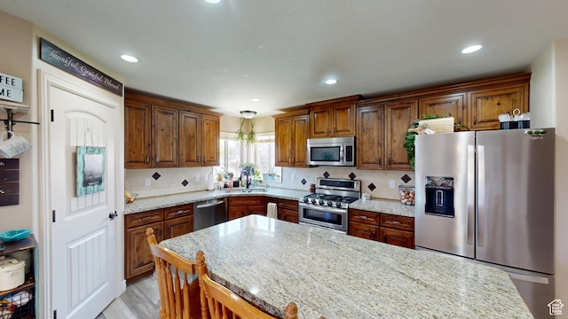 1605 W 1400 S, Vernal, UT 84078 - kitchen with appliances with stainless steel finishes, light stone counters, backsplash, recessed lighting, and light wood-style flooring