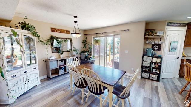 1605 W 1400 S, Vernal, UT 84078 - dining room featuring light wood finished floors and a textured ceiling