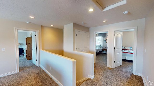 1605 W 1400 S, Vernal, UT 84078 - hall with carpet floors, an upstairs landing, a textured ceiling, attic access, and recessed lighting