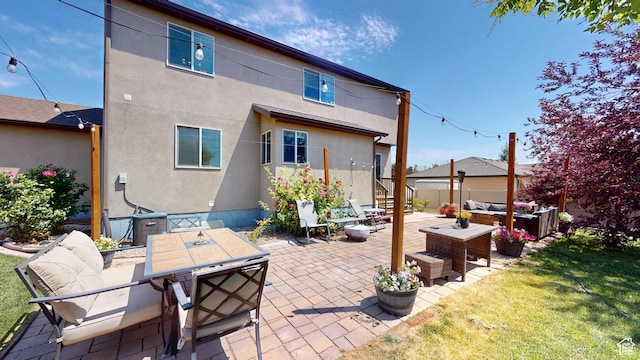 1605 W 1400 S, Vernal, UT 84078 - rear view of house with an outdoor hangout area, a patio area, stucco siding, a yard, and outdoor dining space
