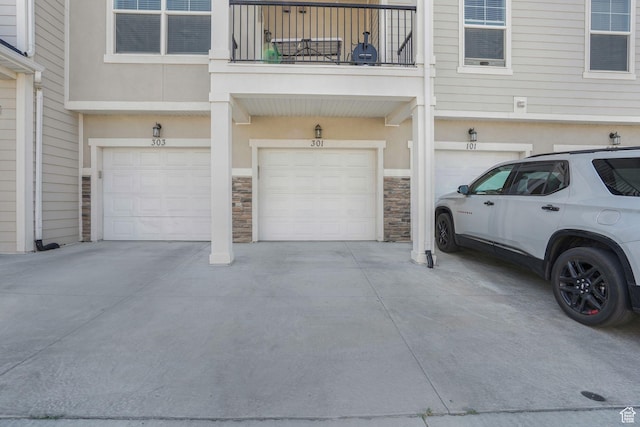 13054 S Tortola Dr W Unit 301, Herriman, UT 84096 - garage featuring driveway