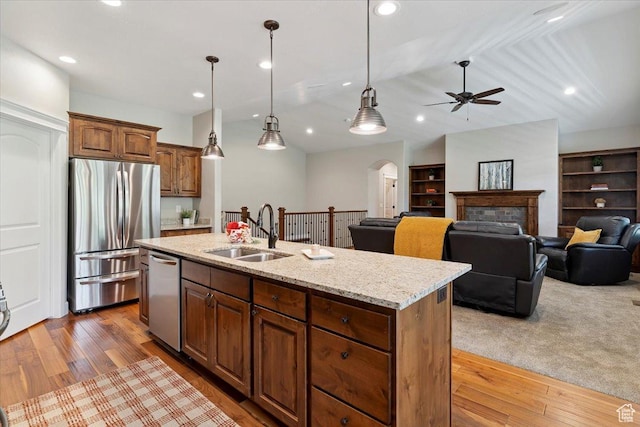 2681 E Sunshine Ct S, South Weber, UT 84405 - kitchen featuring appliances with stainless steel finishes, arched walkways, ceiling fan, wood finished floors, and recessed lighting