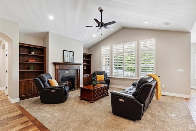 2681 E Sunshine Ct S, South Weber, UT 84405 - living area featuring a tile fireplace, a ceiling fan, light wood-style flooring, lofted ceiling, and recessed lighting