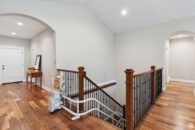 2681 E Sunshine Ct S, South Weber, UT 84405 - corridor featuring an upstairs landing, arched walkways, wood finished floors, recessed lighting, and lofted ceiling