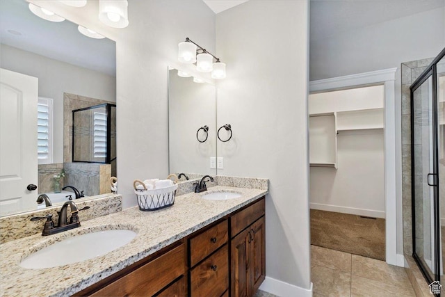 2681 E Sunshine Ct S, South Weber, UT 84405 - full bath featuring a shower stall, a walk in closet, double vanity, and tile patterned flooring