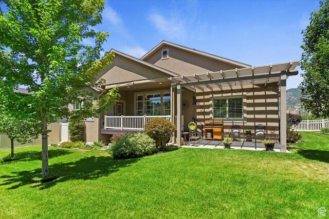 2681 E Sunshine Ct S, South Weber, UT 84405 - back of property featuring stucco siding, a pergola, a patio, and outdoor lounge area