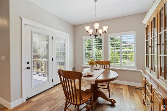 2681 E Sunshine Ct S, South Weber, UT 84405 - dining area featuring a chandelier and light wood finished floors