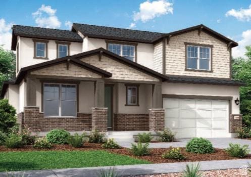 1867 E Moho Mtn, Eagle Mountain, UT 84005 - view of front of house featuring an attached garage, brick siding, stucco siding, and concrete driveway