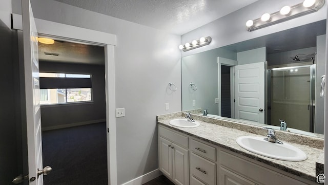 4442 W Hill Shadow Way S, Herriman, UT 84096 - bathroom featuring double vanity, a shower stall, and a textured ceiling