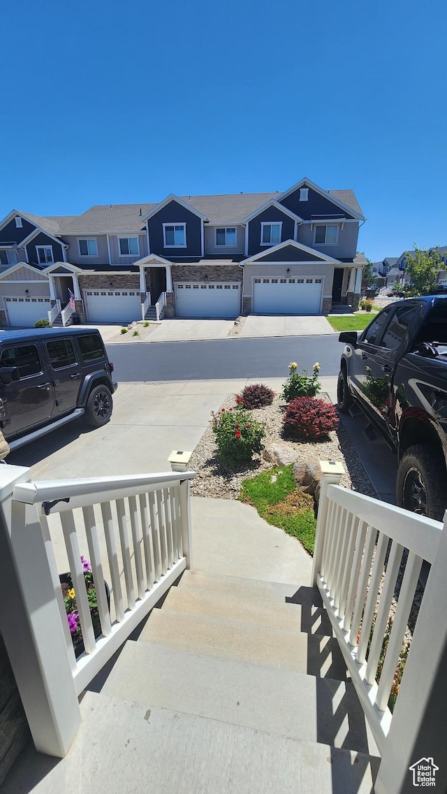 4442 W Hill Shadow Way S, Herriman, UT 84096 - view of yard with a residential view, concrete driveway, and a garage