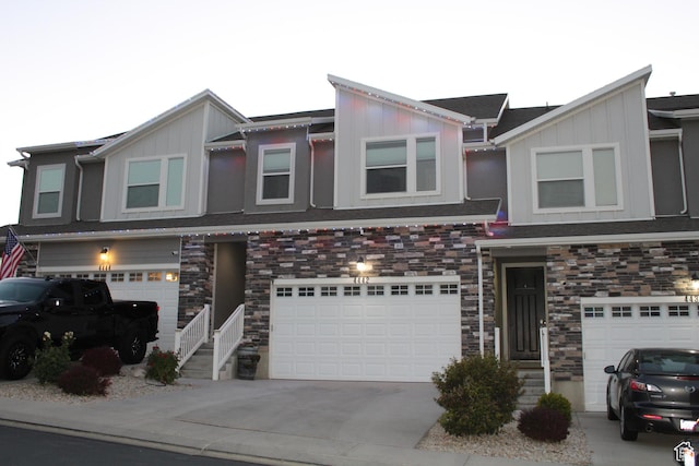 4442 W Hill Shadow Way S, Herriman, UT 84096 - multi unit property with board and batten siding, a garage, and stone siding