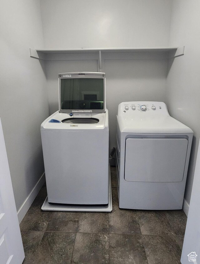 4442 W Hill Shadow Way S, Herriman, UT 84096 - laundry room with baseboards and washer and dryer