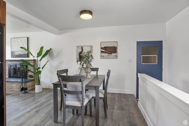 1908 W Champagne Ave, Taylorsville, UT 84129 - dining space featuring dark wood-style floors and baseboards