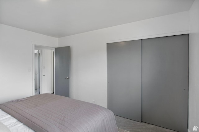1908 W Champagne Ave, Taylorsville, UT 84129 - bedroom with a closet and carpet flooring