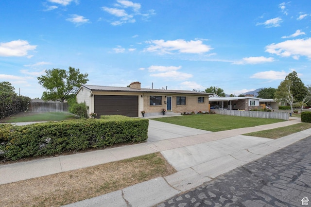 1908 W Champagne Ave, Taylorsville, UT 84129 - ranch-style house featuring an attached garage, a chimney, concrete driveway, and brick siding
