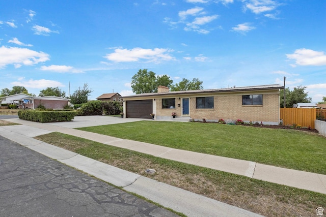 1908 W Champagne Ave, Taylorsville, UT 84129 - ranch-style house with concrete driveway, brick siding, a garage, and a chimney