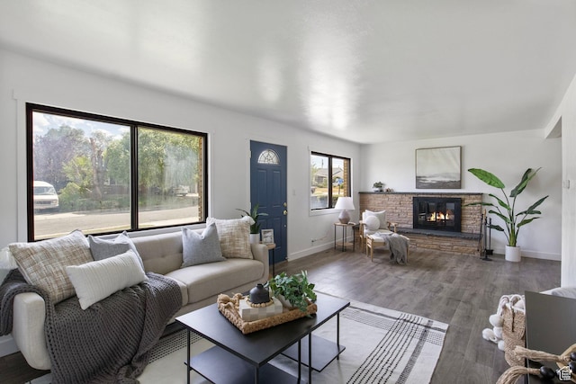 1908 W Champagne Ave, Taylorsville, UT 84129 - living area featuring a stone fireplace and wood finished floors