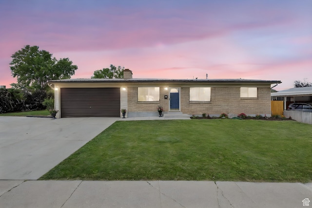 1908 W Champagne Ave, Taylorsville, UT 84129 - ranch-style home featuring a garage, a chimney, concrete driveway, and brick siding