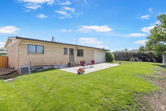 1908 W Champagne Ave, Taylorsville, UT 84129 - back of house featuring brick siding and a patio area