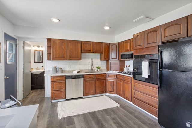 1908 W Champagne Ave, Taylorsville, UT 84129 - kitchen featuring black appliances, dark wood-style flooring, tasteful backsplash, light countertops, and open shelves