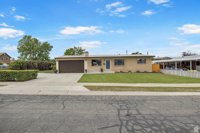 1908 W Champagne Ave, Taylorsville, UT 84129 - ranch-style home with driveway, an attached garage, a chimney, and brick siding
