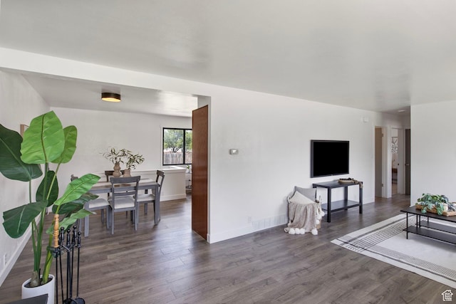 1908 W Champagne Ave, Taylorsville, UT 84129 - living room featuring wood finished floors and baseboards