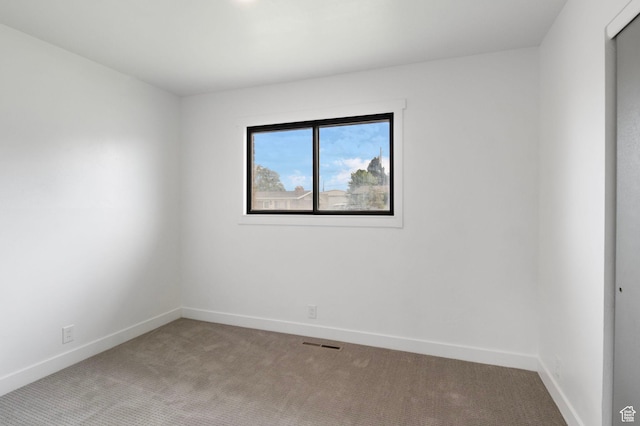 1908 W Champagne Ave, Taylorsville, UT 84129 - carpeted empty room featuring baseboards