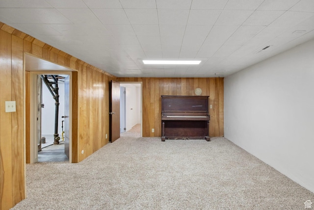 1908 W Champagne Ave, Taylorsville, UT 84129 - unfurnished living room with carpet and wood walls