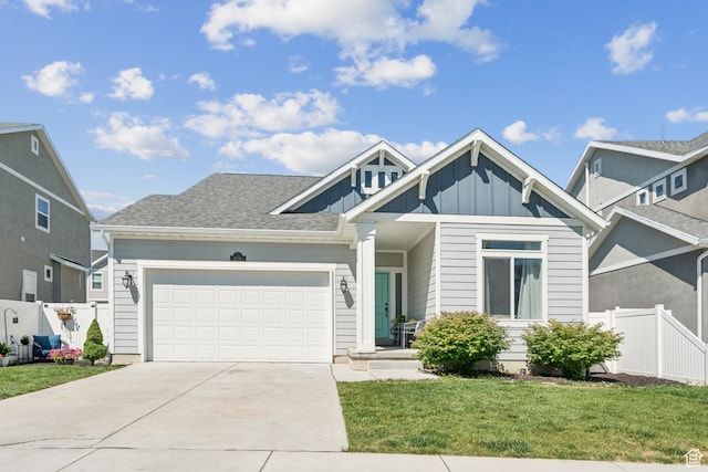 1076 S Meadow Walk Ln, Heber City, UT 84032 - view of front facade featuring driveway, an attached garage, and board and batten siding