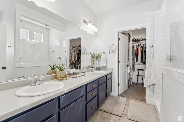 1076 S Meadow Walk Ln, Heber City, UT 84032 - bathroom featuring a spacious closet, double vanity, tile patterned floors, and a tile shower