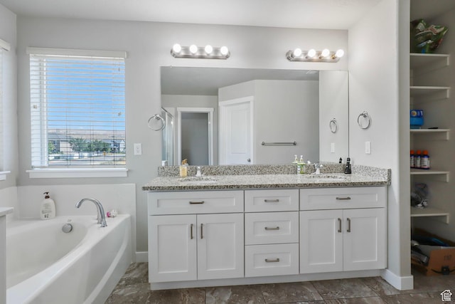 1017 W Coyote Gulch Way S Unit 117, Bluffdale, UT 84065 - bathroom with double vanity and a bath