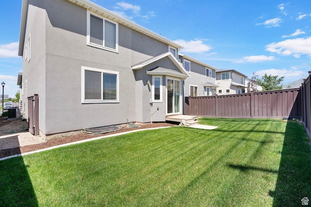 1017 W Coyote Gulch Way S Unit 117, Bluffdale, UT 84065 - rear view of property with stucco siding