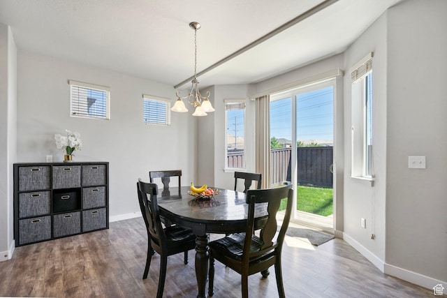 1017 W Coyote Gulch Way S Unit 117, Bluffdale, UT 84065 - dining area with a chandelier and wood finished floors