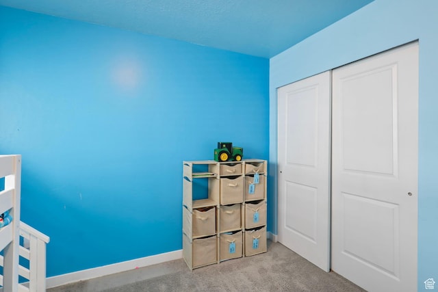 1017 W Coyote Gulch Way S Unit 117, Bluffdale, UT 84065 - carpeted bedroom with baseboards and a closet