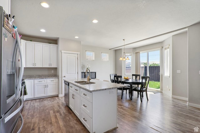 1017 W Coyote Gulch Way S Unit 117, Bluffdale, UT 84065 - kitchen with appliances with stainless steel finishes, dark wood-style flooring, white cabinets, and recessed lighting
