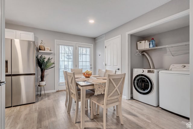 3699 S Botticelli Ct Unit C, Salt Lake City, UT 84119 - dining area with washing machine and dryer, light wood finished floors, and recessed lighting