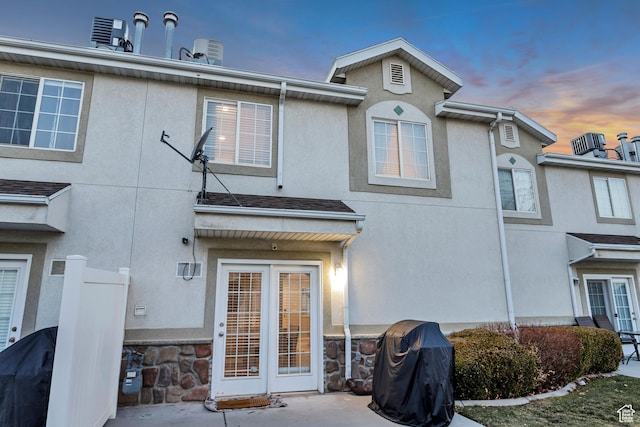 3699 S Botticelli Ct Unit C, Salt Lake City, UT 84119 - back of property at dusk featuring stucco siding