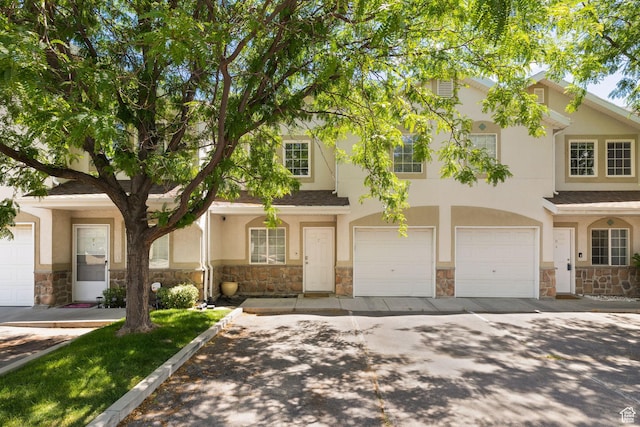 3699 S Botticelli Ct Unit C, Salt Lake City, UT 84119 - multi unit property with stone siding, stucco siding, and an attached garage