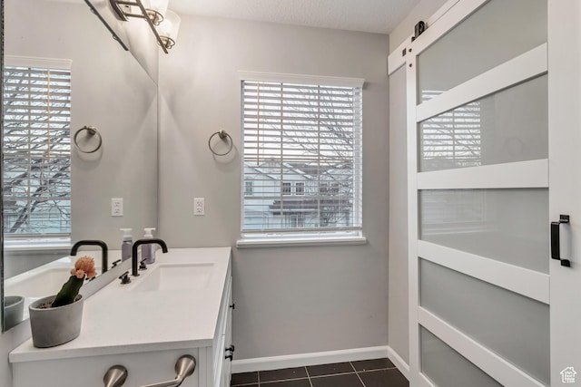 3699 S Botticelli Ct Unit C, Salt Lake City, UT 84119 - bathroom featuring tile patterned floors, healthy amount of natural light, and vanity