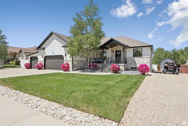 273 N 200 W Unit 1, Kamas, UT 84036 - view of front of house featuring stone siding, a front lawn, concrete driveway, and an attached garage