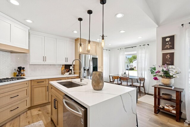 273 N 200 W Unit 1, Kamas, UT 84036 - kitchen featuring stainless steel appliances, light wood-style floors, decorative backsplash, and recessed lighting
