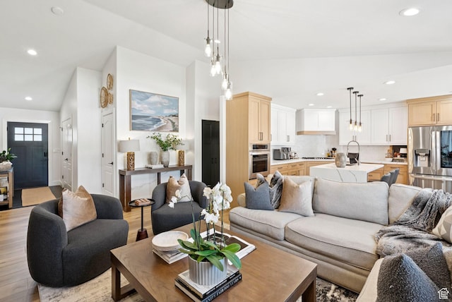 273 N 200 W Unit 1, Kamas, UT 84036 - living area with vaulted ceiling, recessed lighting, and light wood-style flooring